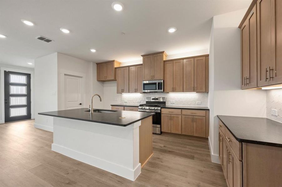 No shortage of storage, prep space or style in this over the top kitchen!