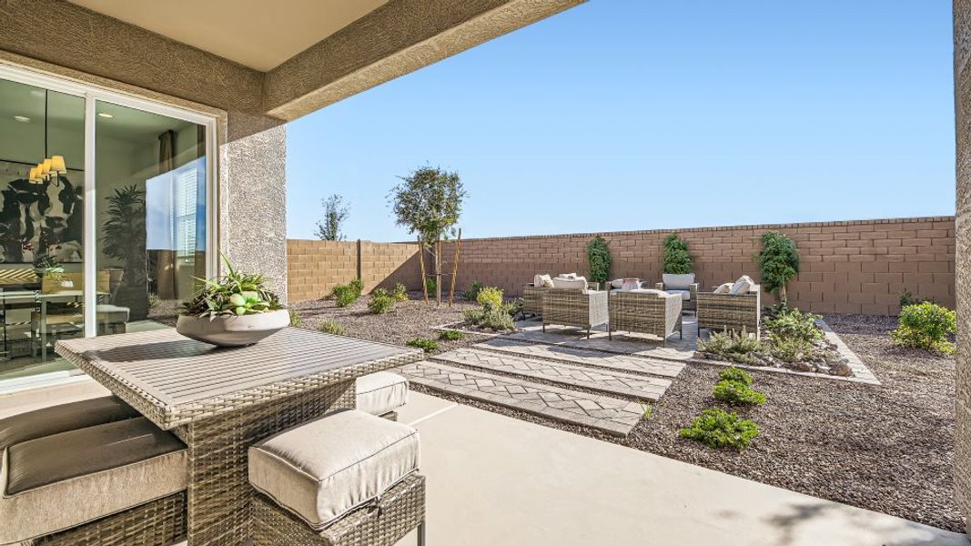 Covered patio styled with outdoor dining furniture