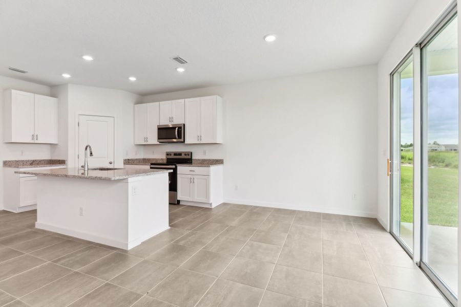 Dining area of the Bluebell plan in Lakes at Bella Lago.