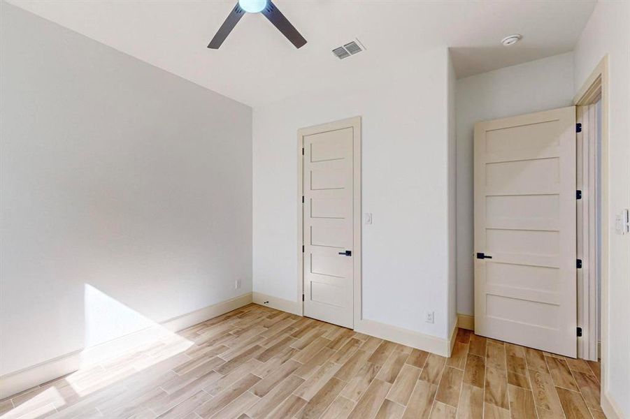 Unfurnished bedroom with a closet, ceiling fan, and light hardwood / wood-style flooring