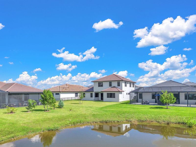 Front exterior of a new home in , Ave Maria, FL, highlighting curb appeal (Image 24).