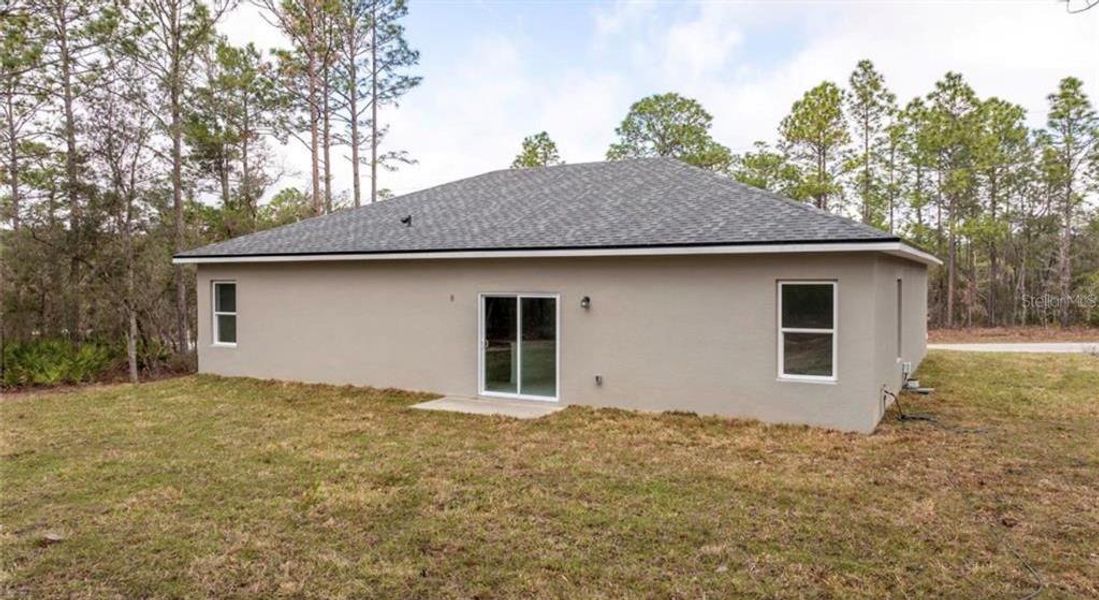 Exterior details and patio area of a home in , Citrus Springs (Image 4).