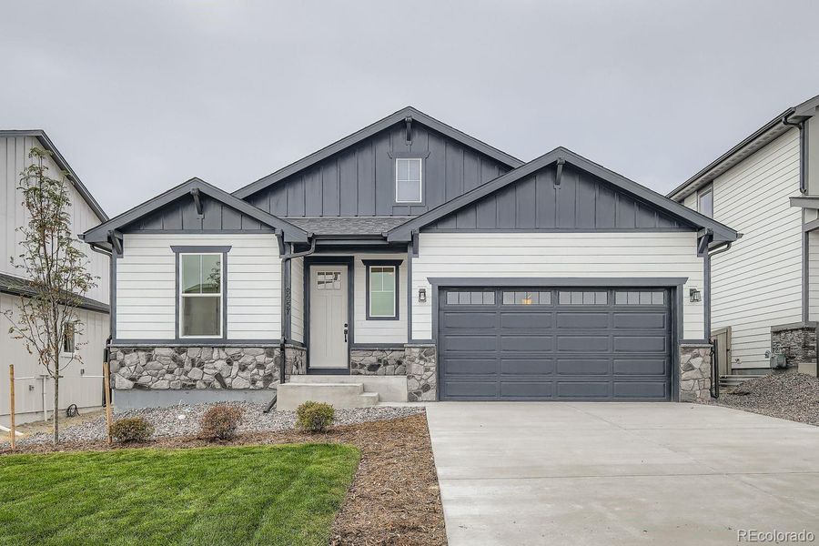 Front exterior of a new home in , Colorado Springs, CO, highlighting curb appeal (Image 1).