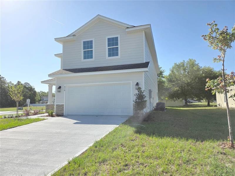 Front exterior of a new home in The Preserve at Laurel Lake, Lake City, FL, highlighting curb appeal (Image 14).