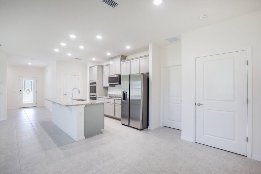 Furnished interior view inside a new home in Heritage Station, Punta Gorda (Image 5).