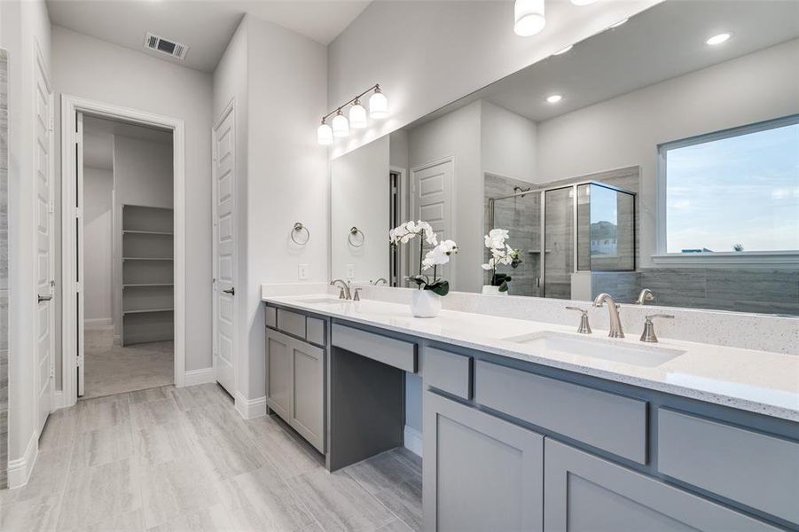 Bathroom with vanity and an enclosed shower