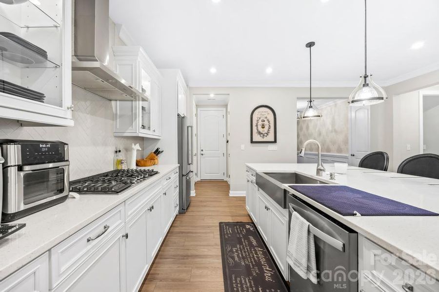 Sellers upgraded lighting in kitchen with pendants