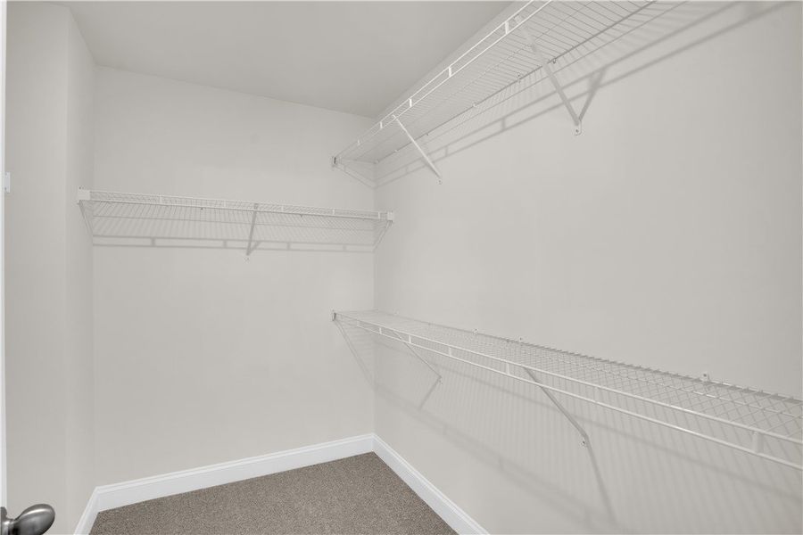 This spacious walk-in closet offers abundant stora This spacious walk-in closet offers abundant stora