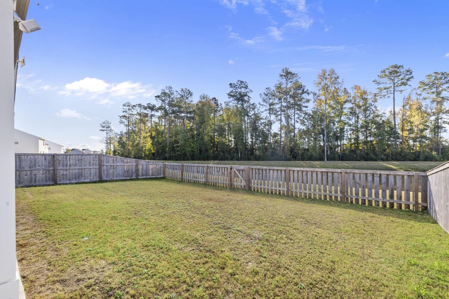 Exterior details and patio area of a home in K. Hovnanian's® Four Seasons at Lakes of Cane Bay, Summerville (Image 24). Exterior details and patio area of a home in K. Hovnanian's® Four Seasons at Lakes of Cane Bay, Summerville (Image 24).