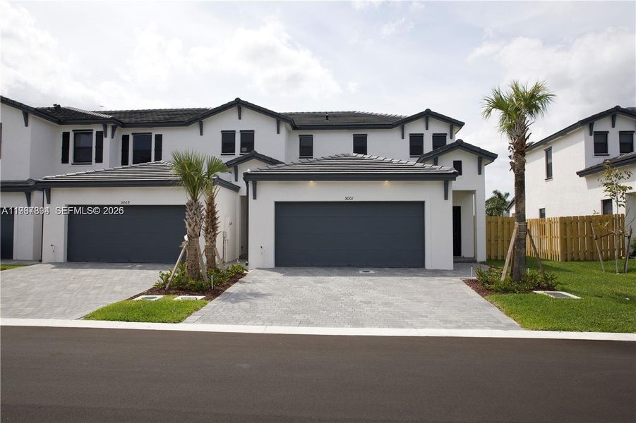 Front exterior of a new home in , Dania Beach, FL, highlighting curb appeal (Image 1). Front exterior of a new home in , Dania Beach, FL, highlighting curb appeal (Image 1).
