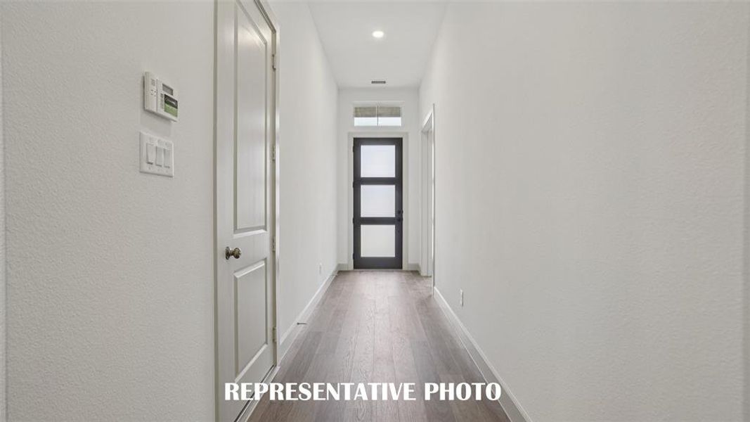 With ample wall space to display art work, this stylish entry area is the perfect place to welcome family and friends into your new home!  REPRESENTATIVE PHOTO