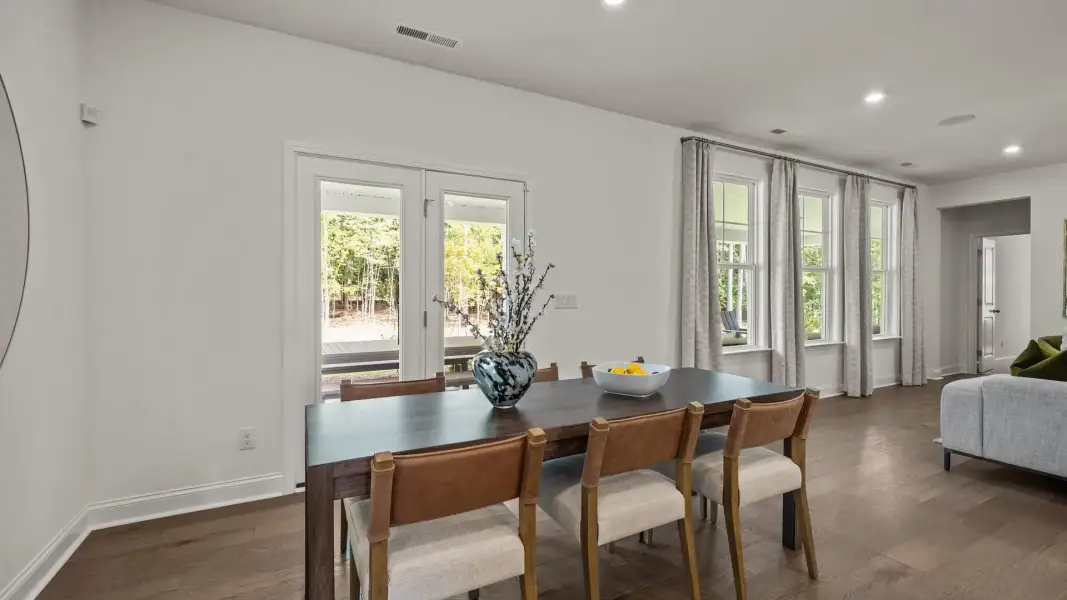 Eat-in breakfast area with large windows and access to the extended rear covered porch, in the Townsend Design by DRB Homes Eat-in breakfast area with large windows and access to the extended rear covered porch, in the Townsend Design by DRB Homes
