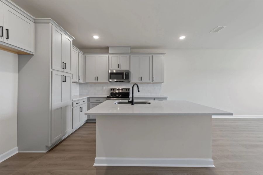 Furnished interior view inside a new home in Blue Heron Retreat, Little River (Image 7).