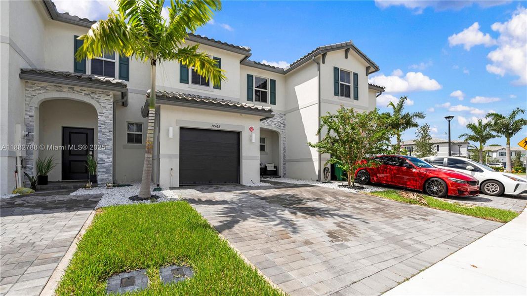 Front exterior of a new home in , Coral Springs, FL, highlighting curb appeal (Image 2).
