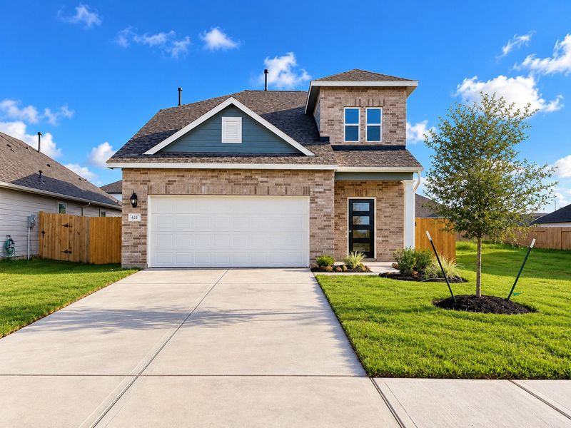 Front exterior of a new home in Trails at Woodhaven Lakes, La Marque, TX, highlighting curb appeal (Image 1). Front exterior of a new home in Trails at Woodhaven Lakes, La Marque, TX, highlighting curb appeal (Image 1).