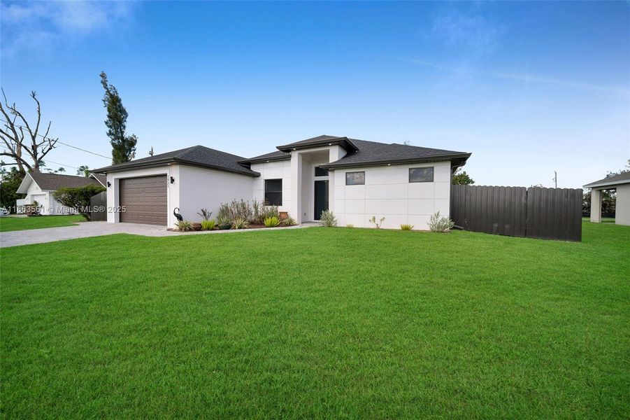 Front exterior of a new home in , Cape Coral, FL, highlighting curb appeal (Image 1).