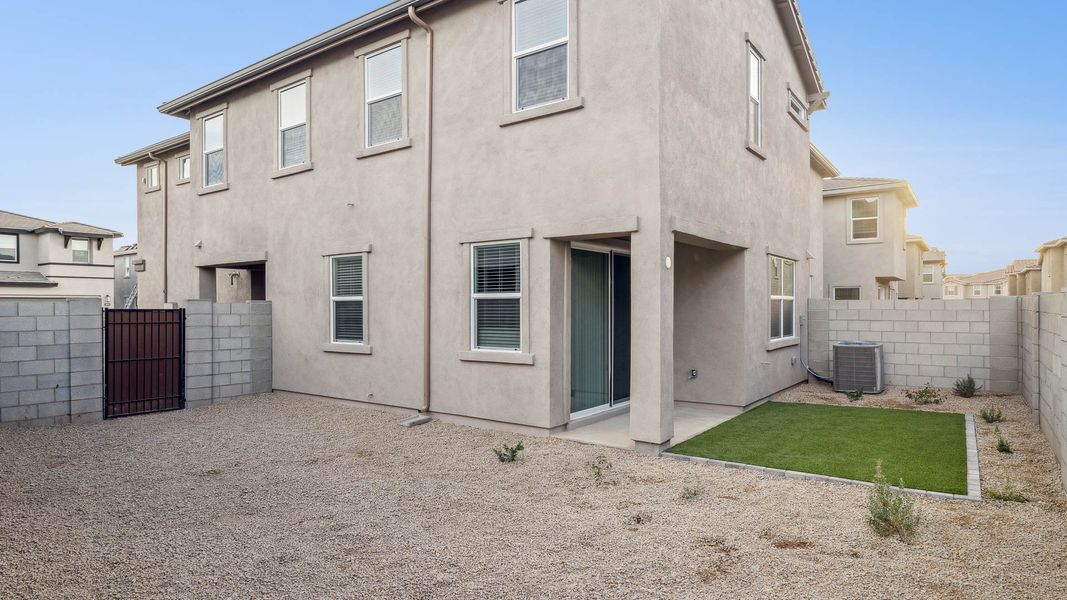 Exterior details and patio area of a home in Talinn Towns at Desert Ridge, Phoenix (Image 4).