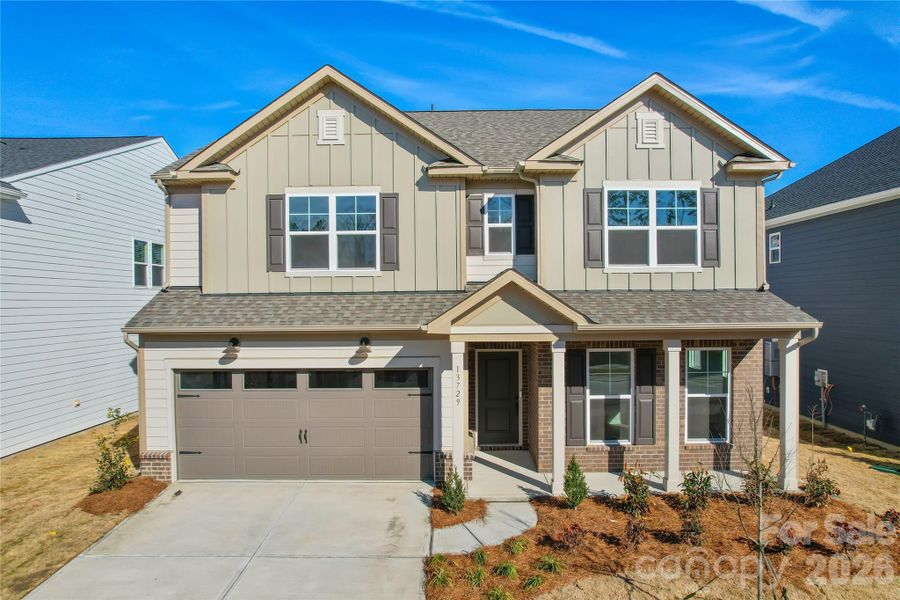 Front exterior of a new home in Riverstone, Monroe, NC, highlighting curb appeal (Image 2). Front exterior of a new home in Riverstone, Monroe, NC, highlighting curb appeal (Image 2).