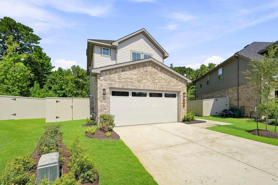 Front exterior of a new home in Audubon, Magnolia, TX, highlighting curb appeal (Image 19).