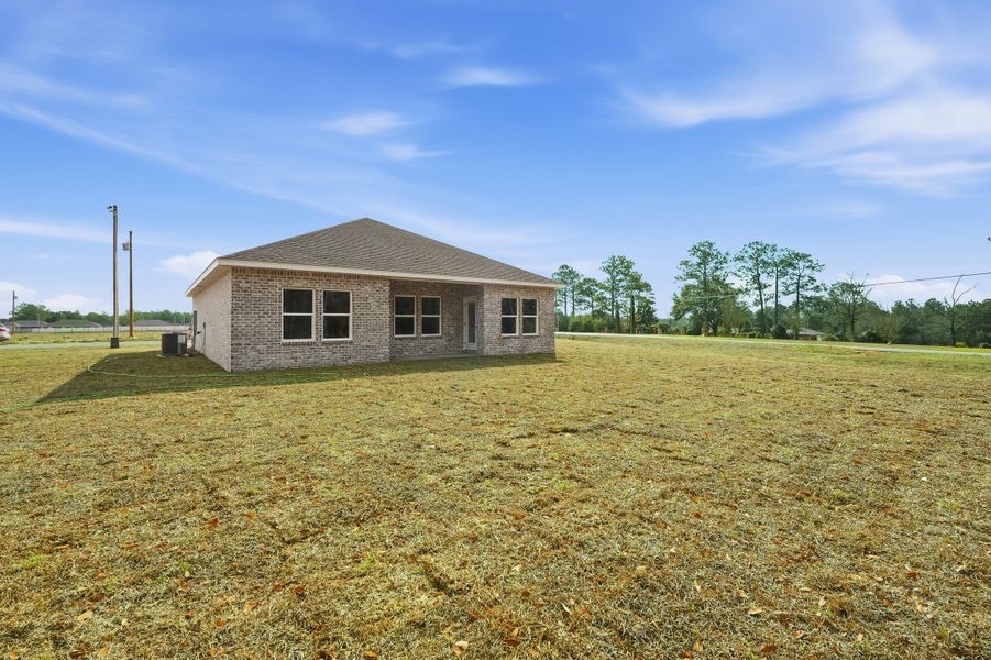 Exterior details and patio area of a home in Southern Charm, Crestview (Image 26).