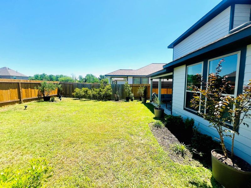 Exterior details and patio area of a home in Bluebonnet Village, Bellville (Image 25).