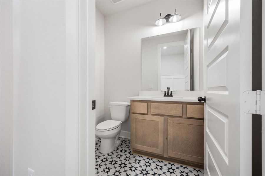 Bathroom with vanity and light tile patterned floors