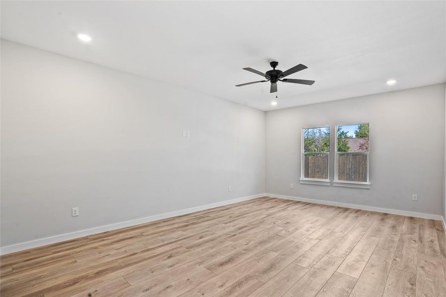 Unfurnished room with light wood finished floors, recessed lighting, and a ceiling fan