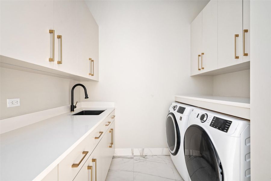 Spacious laundry room with elegant built-in storage.