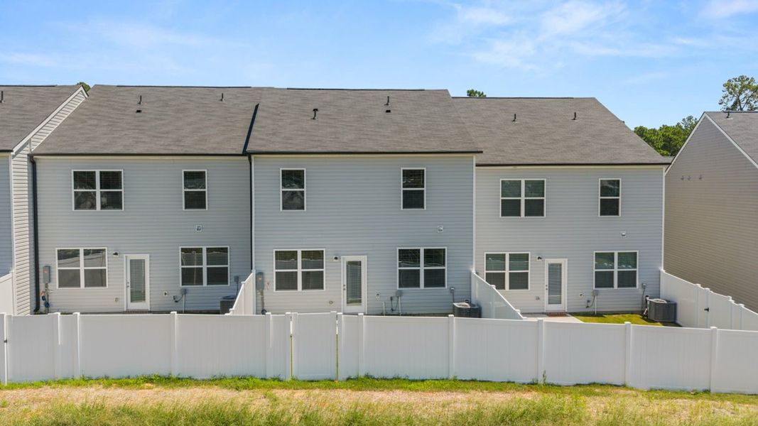 Exterior details and patio area of a home in Rushing Waters Townhomes, North Augusta (Image 18). Exterior details and patio area of a home in Rushing Waters Townhomes, North Augusta (Image 18).