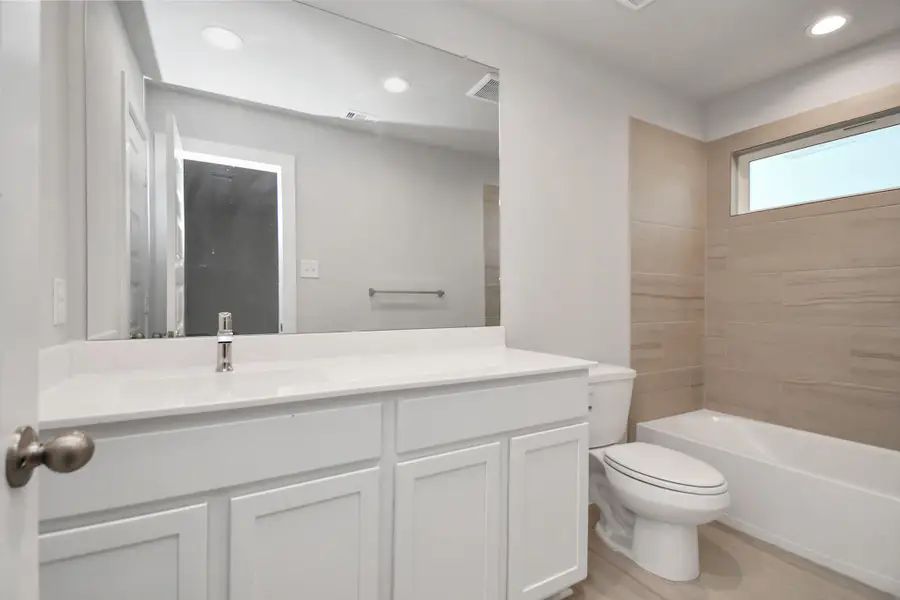 Guest suite full bathroom. Sample photo of completed home with similar floor plan. Actual colors and selections may vary. Guest suite full bathroom. Sample photo of completed home with similar floor plan. Actual colors and selections may vary.