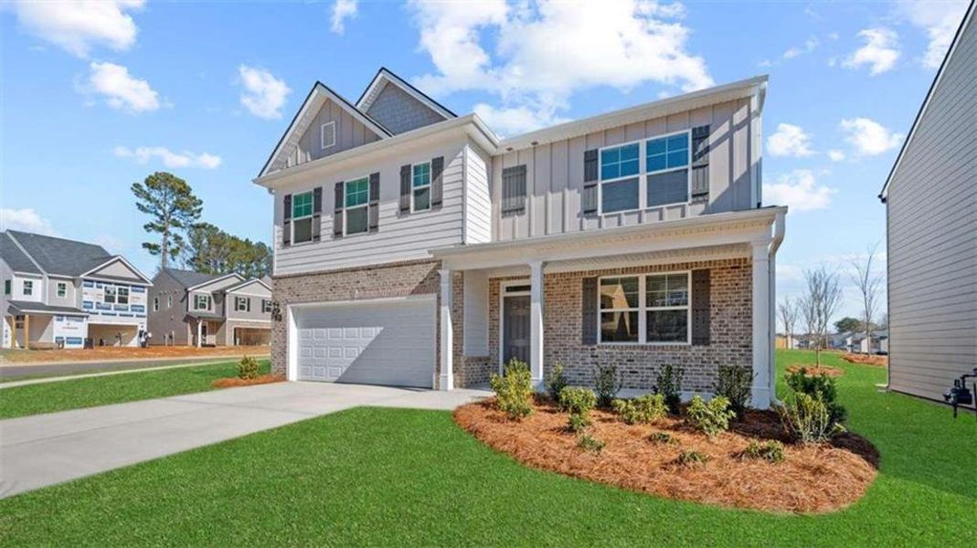 Front exterior of a new home in Poplar Preserve, Newnan, GA, highlighting curb appeal (Image 2).