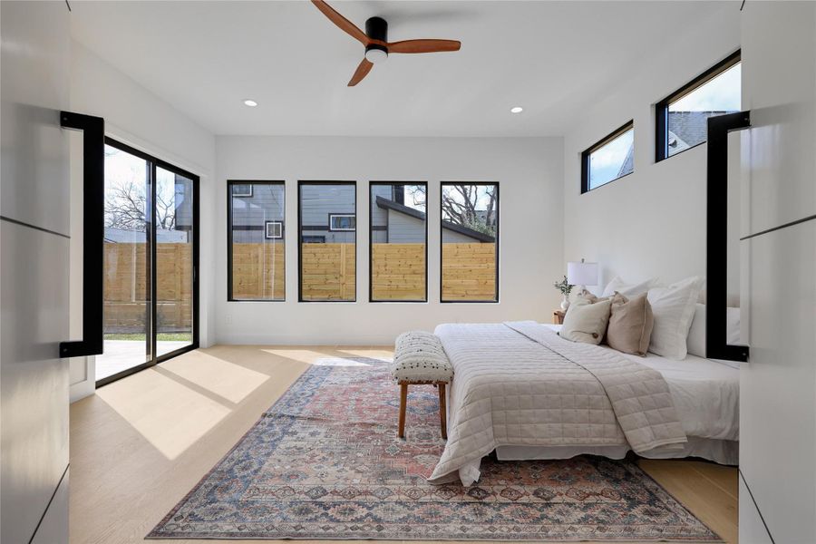 Bedroom featuring access to outside, a ceiling fan, recessed lighting, and light wood-style flooring