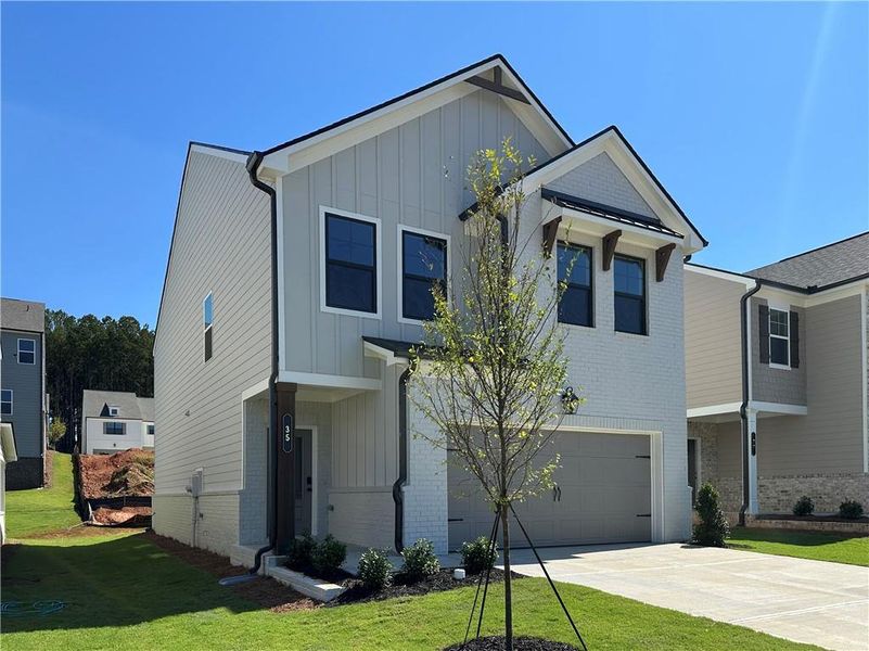 Front exterior of a new home in Kentmere, Auburn, GA, highlighting curb appeal (Image 25).