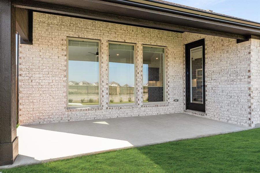 Exterior details and patio area of a home in Timberbrook 3B-4A, Justin (Image 19).