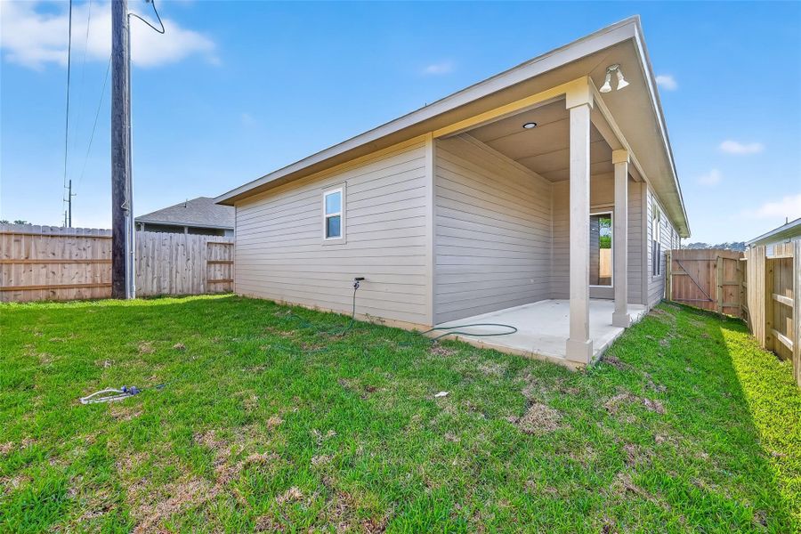 Exterior details and patio area of a home in Mostyn Springs, Magnolia (Image 3).
