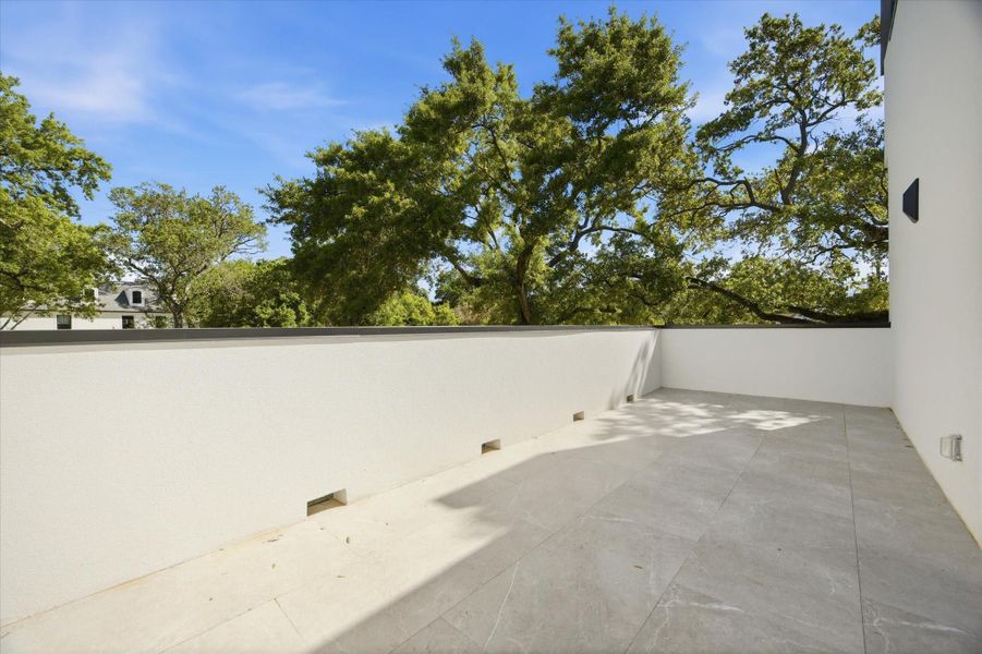 A rare feature, this upstairs bedroom extends outdoors with a private balcony, offering a quiet escape with elevated views.