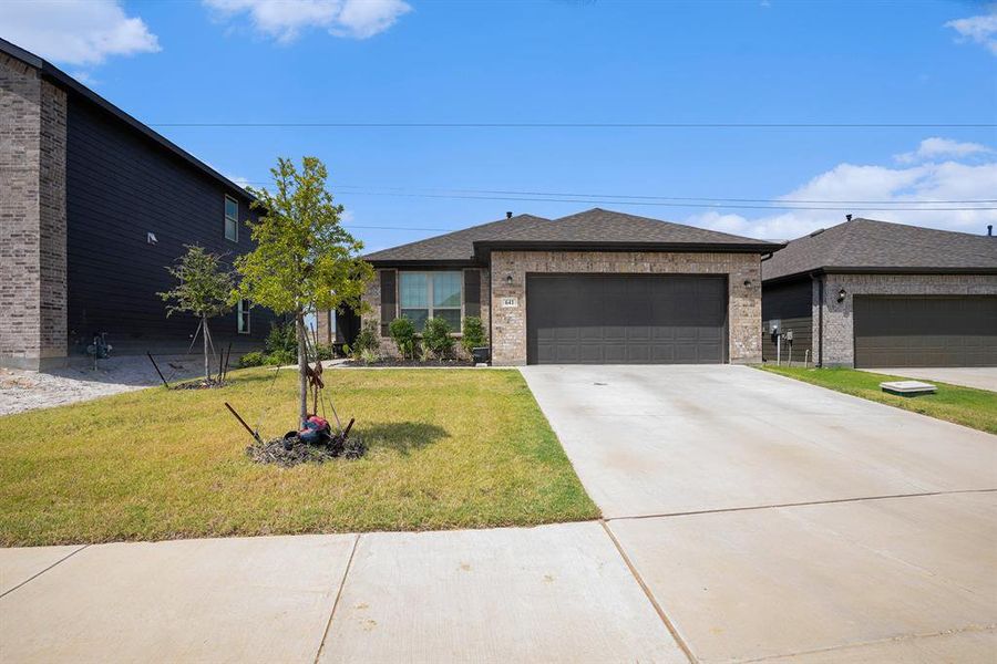 Front exterior of a new home in , Godley, TX, highlighting curb appeal (Image 18). Front exterior of a new home in , Godley, TX, highlighting curb appeal (Image 18).