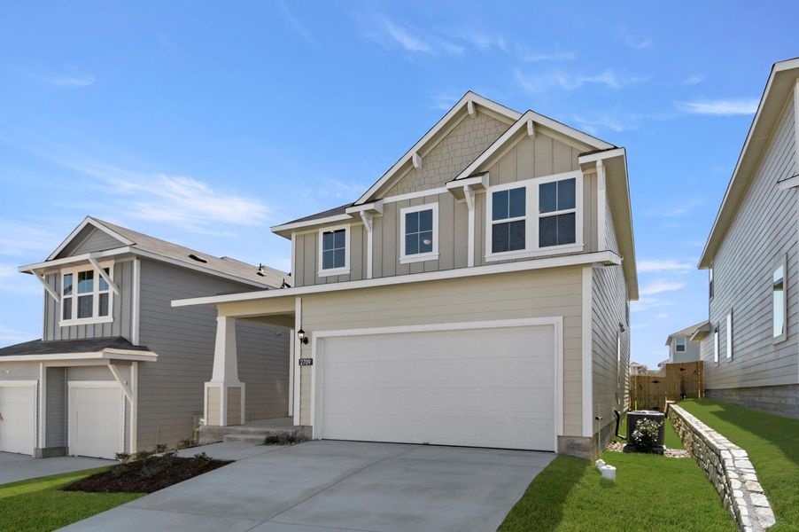 Front exterior of a new home in Edgebrooke, Pflugerville, TX, highlighting curb appeal (Image 2). Front exterior of a new home in Edgebrooke, Pflugerville, TX, highlighting curb appeal (Image 2).