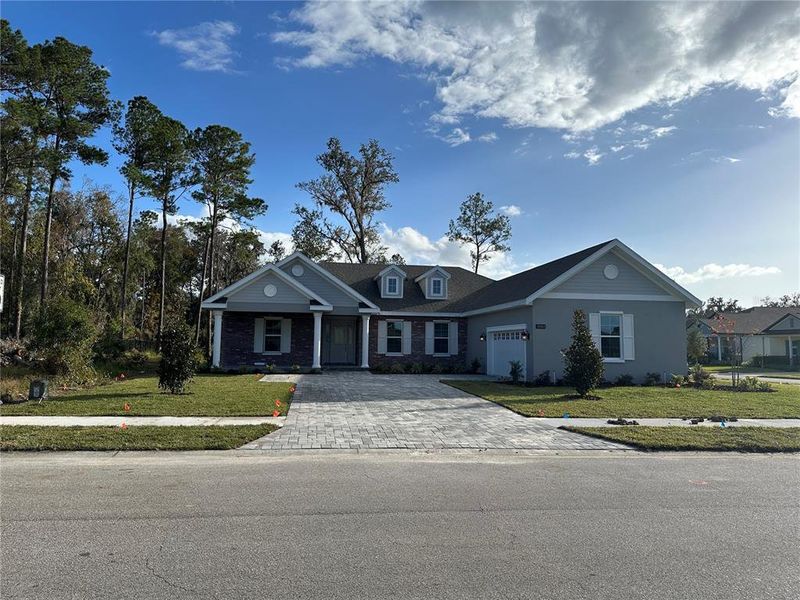 Front exterior of a new home in Southern Hills Plantation, Brooksville, FL, highlighting curb appeal (Image 1). Front exterior of a new home in Southern Hills Plantation, Brooksville, FL, highlighting curb appeal (Image 1).