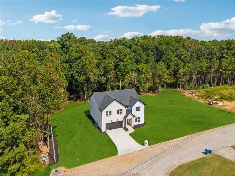 Front exterior of a new home in , Loganville, GA, highlighting curb appeal (Image 21).