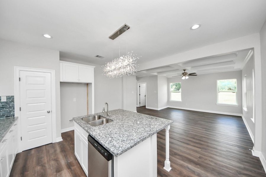 This thoughtfully designed kitchen opens seamlessly into the family room, creating a connected and functional space that’s perfect for entertaining. Whether you're cooking dinner or hosting guests, the open layout allows you to stay engaged with family and friends - (representation photo).