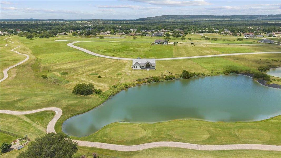 Perched beside a tranquil pond and lush green, this home enjoys peaceful golf course views. Perched beside a tranquil pond and lush green, this home enjoys peaceful golf course views.