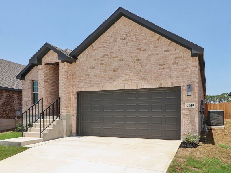 Front exterior of a new home in Kallison Ranch, San Antonio, TX, highlighting curb appeal (Image 21).