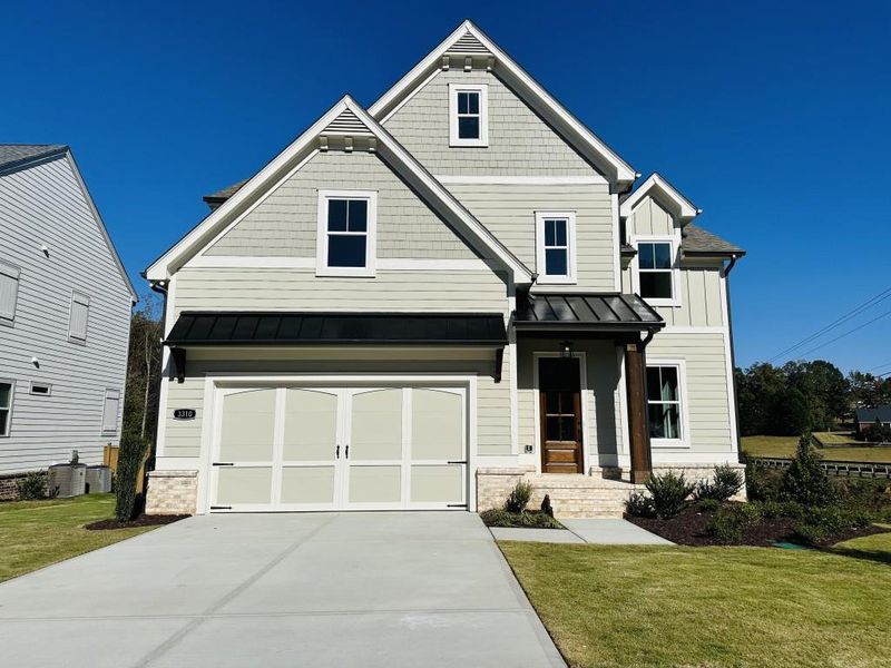 Front exterior of a new home in Hillshire, Cumming, GA, highlighting curb appeal (Image 1).