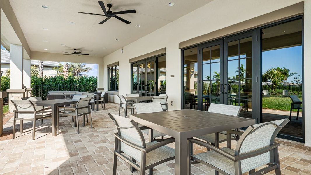 Exterior details and patio area of a home in Esplanade by the Islands, Naples (Image 4).