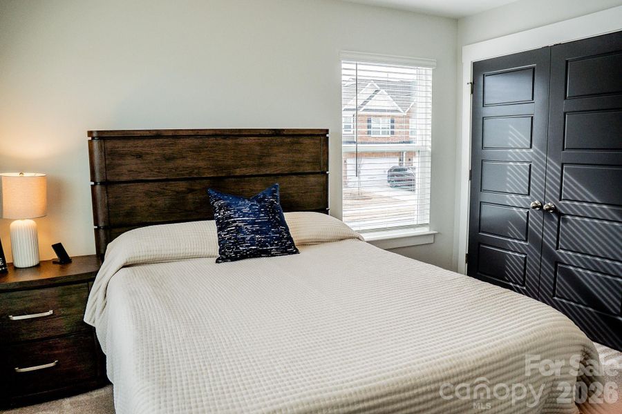 Bedroom #2 with painted closet doors.