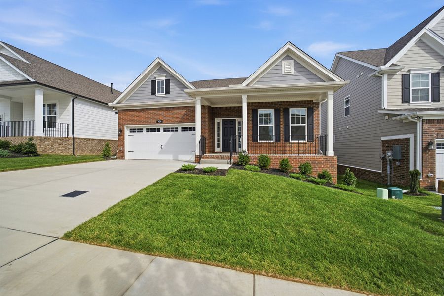 Front exterior of a new home in McCain's Station, Gallatin, TN, highlighting curb appeal (Image 27). Front exterior of a new home in McCain's Station, Gallatin, TN, highlighting curb appeal (Image 27).