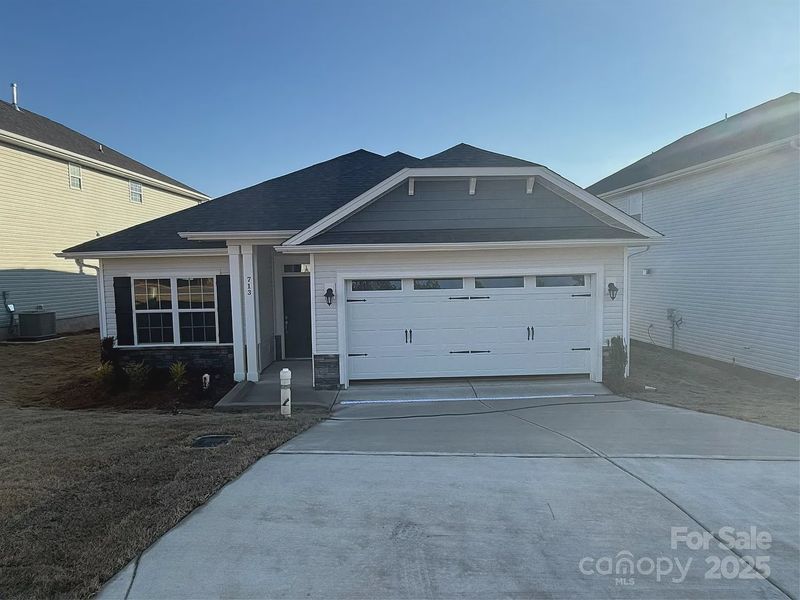 Front exterior of a new home in Village at Parkside, Gastonia, NC, highlighting curb appeal (Image 1). Front exterior of a new home in Village at Parkside, Gastonia, NC, highlighting curb appeal (Image 1).