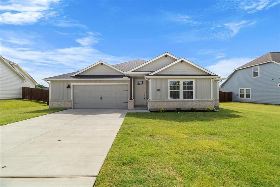 Front exterior of a new home in The Gables At Tioga, Tioga, TX, highlighting curb appeal (Image 29). Front exterior of a new home in The Gables At Tioga, Tioga, TX, highlighting curb appeal (Image 29).
