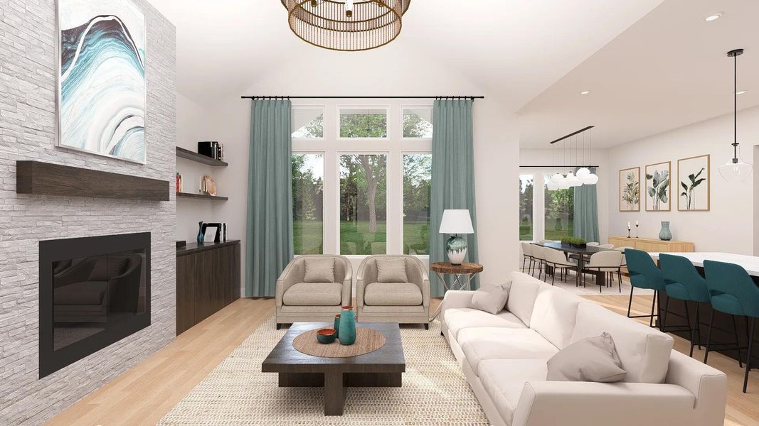 A spacious, naturally illuminated living area featuring an inviting fireplace and large windows that frame verdant outdoor scenery. A spacious, naturally illuminated living area featuring an inviting fireplace and large windows that frame verdant outdoor scenery.
